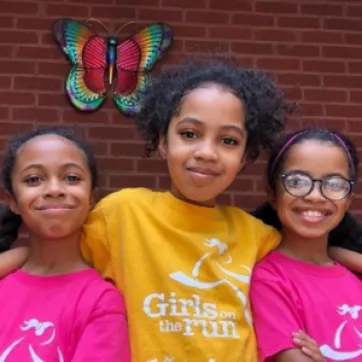 photo of girls standing close together